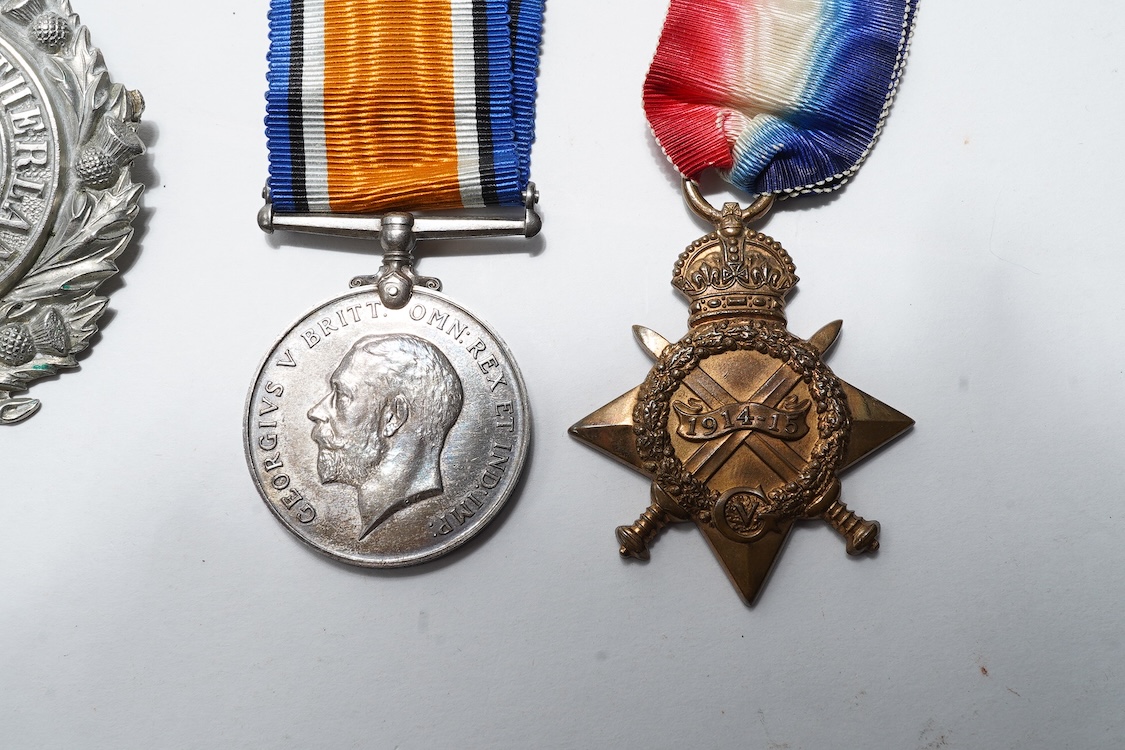 A First World War medal trio awarded to 2140 SJT. G. Watson. Argyll and Sutherland Highlanders, together with the related cap badge and two photographs of Watson in Highlanders uniform and printed as postcards